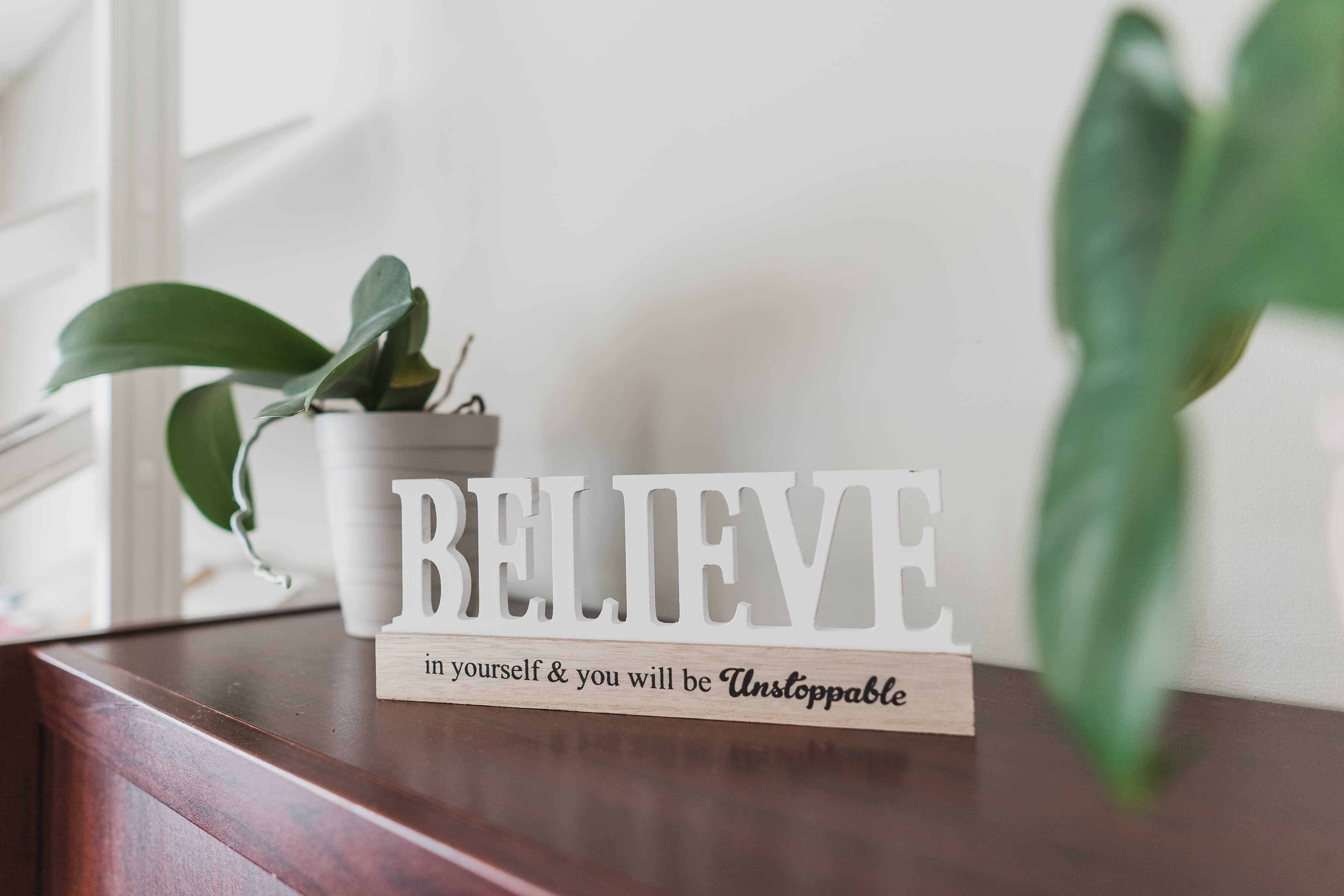 a sign that says believe in yourself & you will be unstoppable