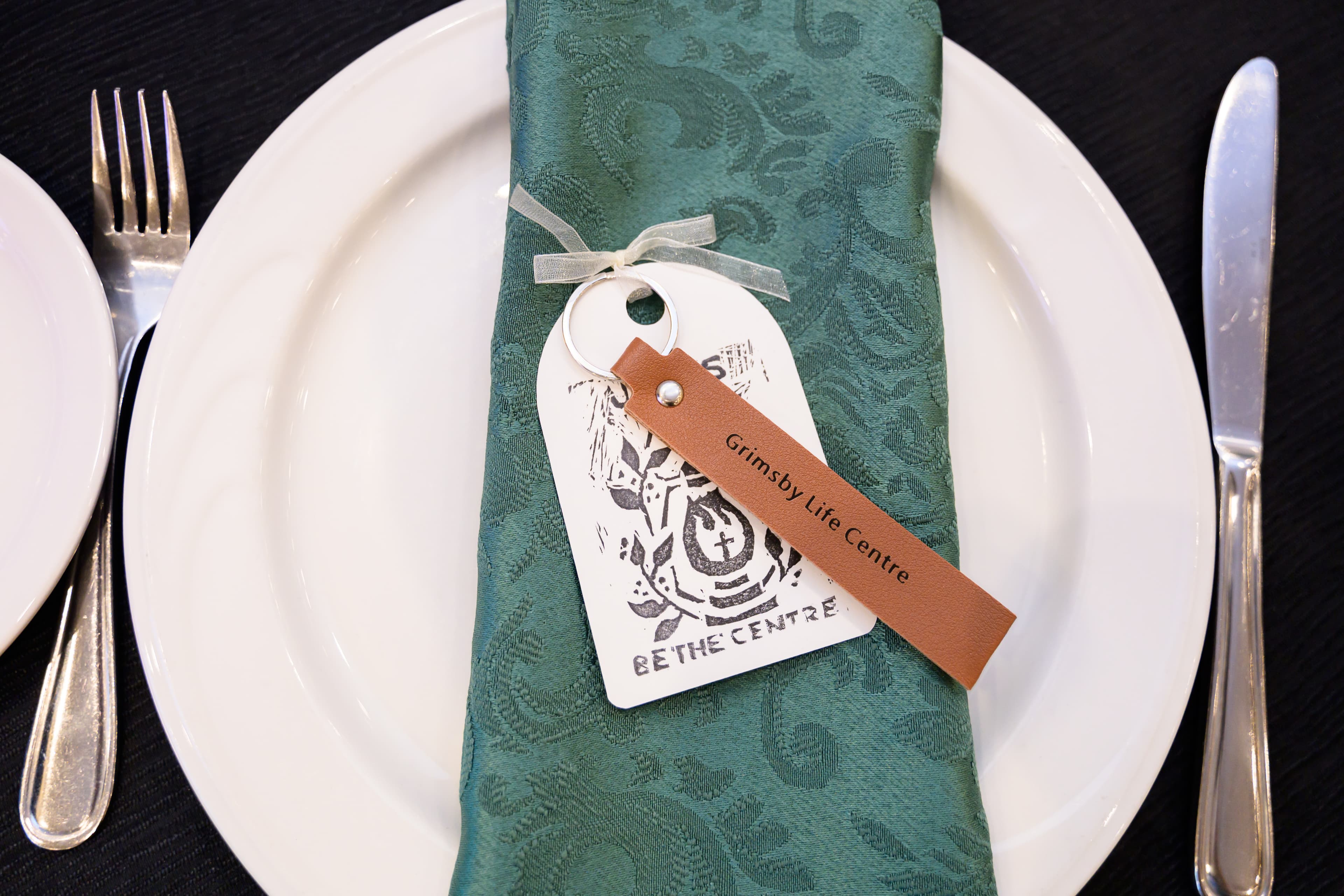 a table setting at a fundraiser event